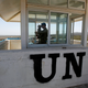 UN peacekeeping soldier, Australian Army Captain Morris uses binoculars from an observation tower located on the Israeli side of the 1973 Golan Heights ceasefire line with Syria